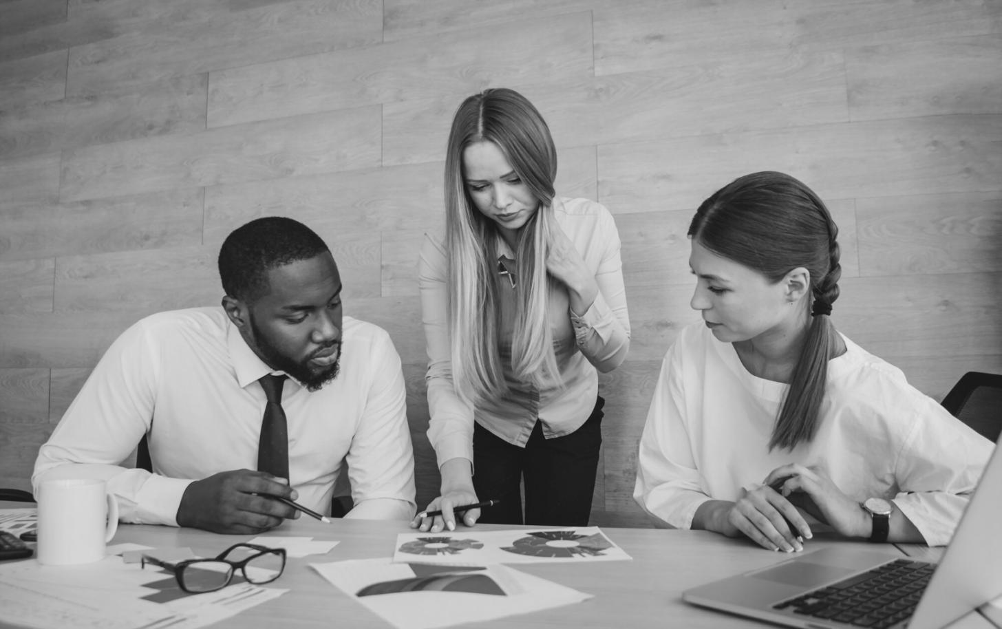Professional financial analysis workspace with spreadsheets and market data